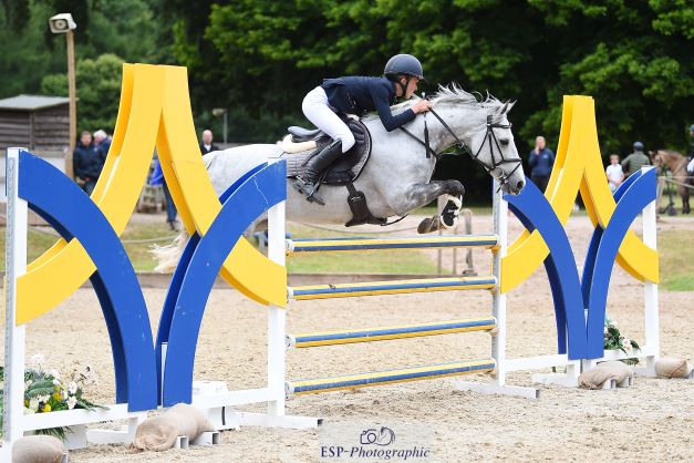 Katie Bradburne riding 13-year-old grey mare Dolly Du Carel